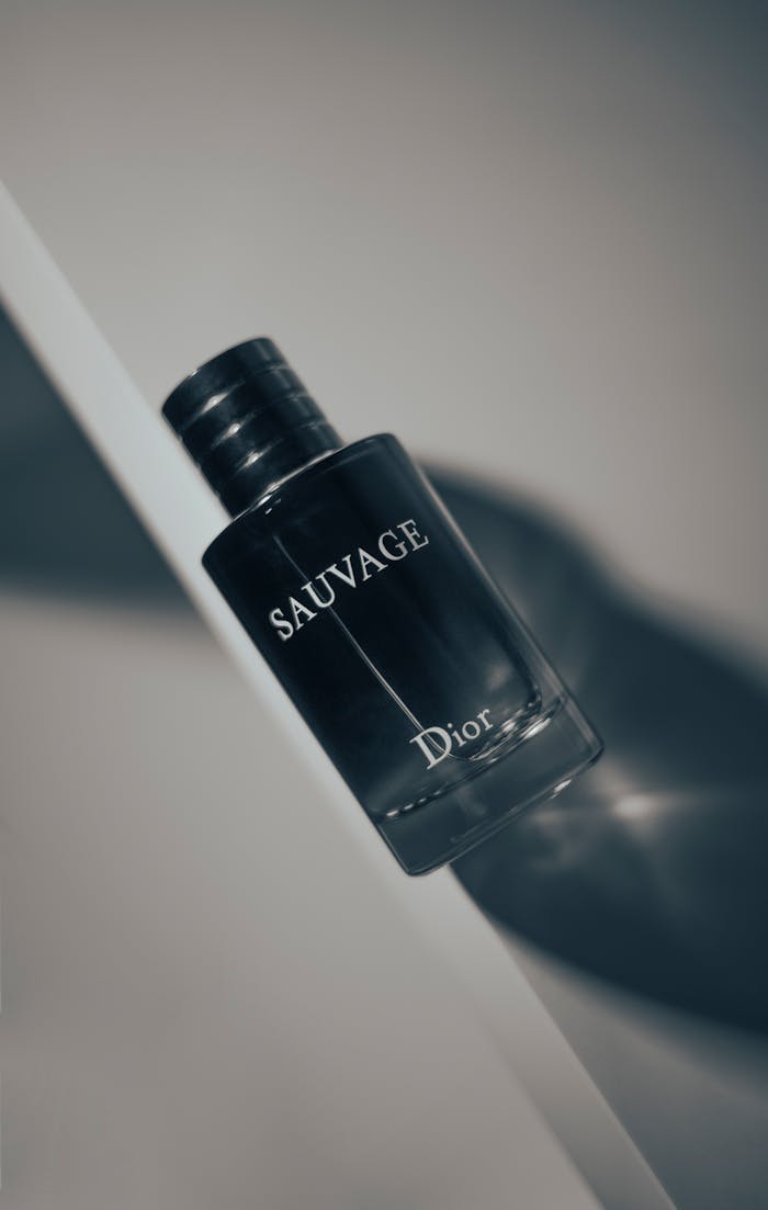 services-04 Stylish product shot of Dior Sauvage perfume bottle highlighting luxury and elegance on a white surface.